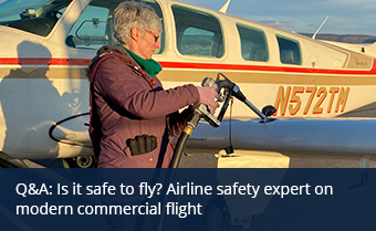 Person putting fuel into a small aircraft at a local airport